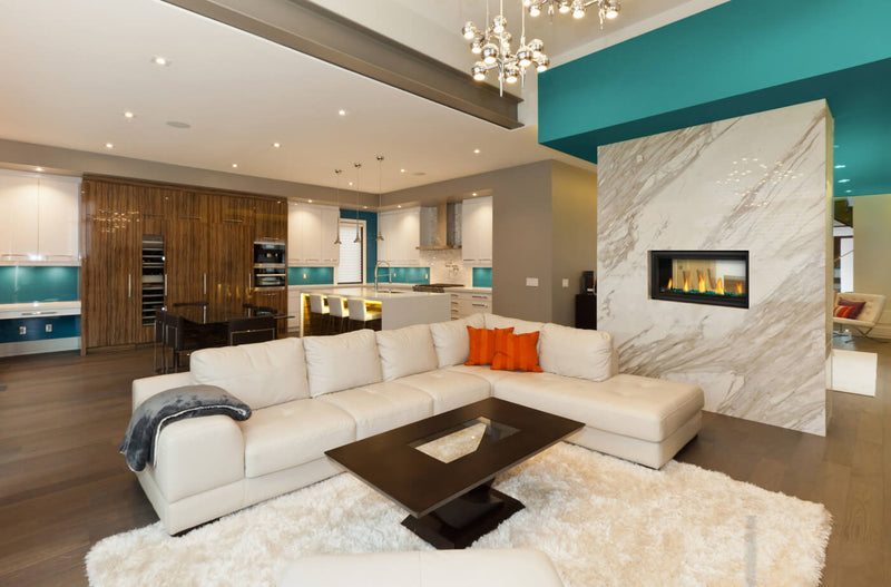 Napoleon Vector 38 See-Through in living room with marble peninsula wall, room visible through firebox