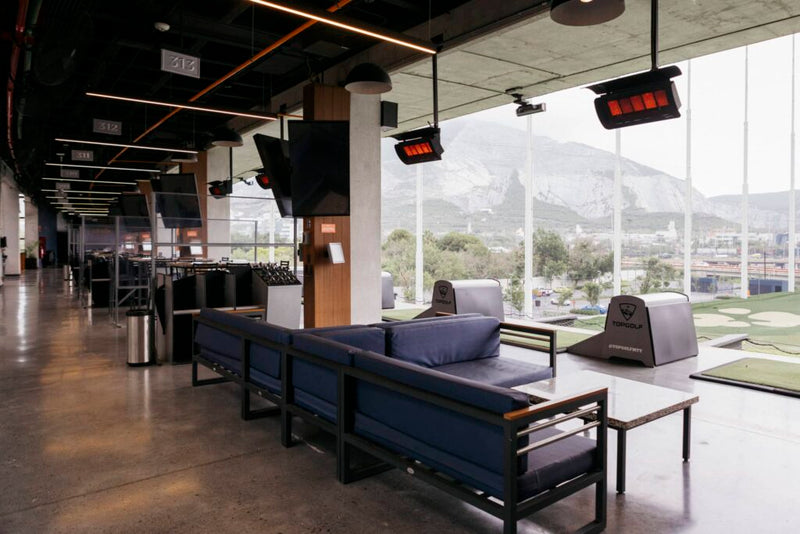 Bromic Tungsten Gas 500 heaters installed at Top Golf Monterrey, scale reference